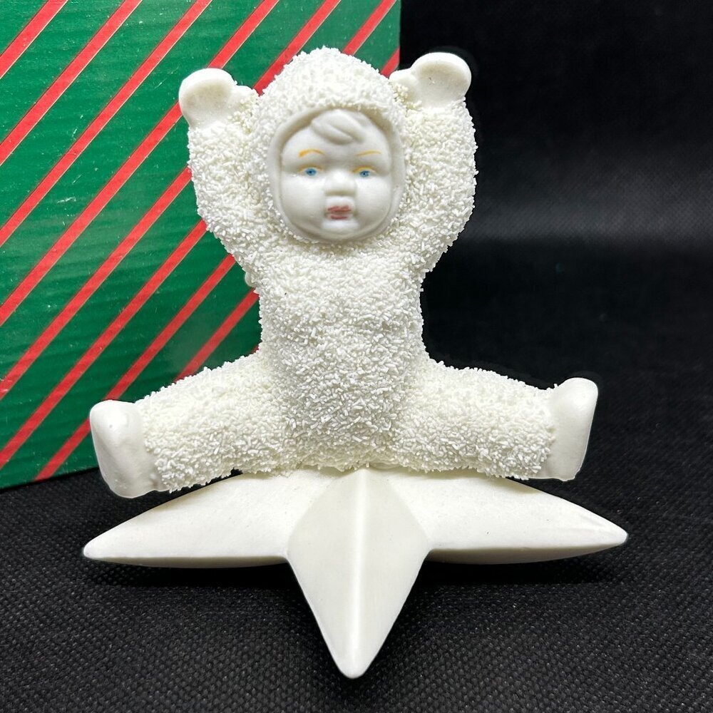 Style like " Snowbabies" star figurine